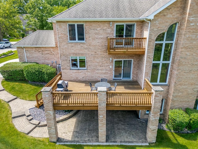 909 Prairie Ridge Ct, Burr Ridge, IL 60527 - back of house featuring a shingled roof, a balcony, and a deck