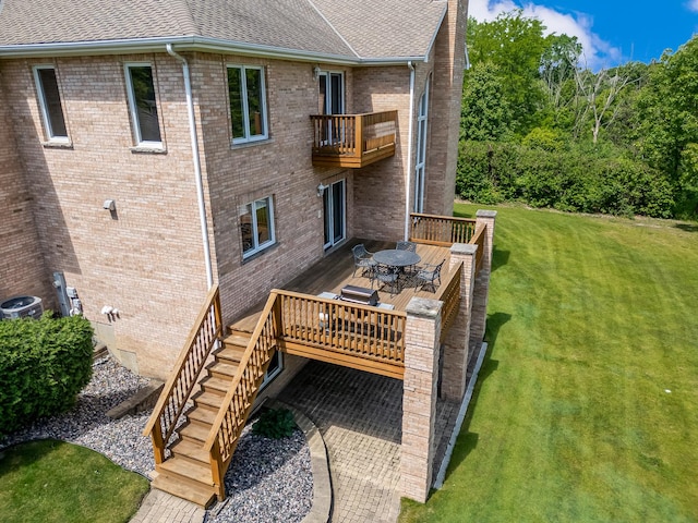 909 Prairie Ridge Ct, Burr Ridge, IL 60527 - back of house with a lawn, a balcony, a shingled roof, a deck, and brick siding