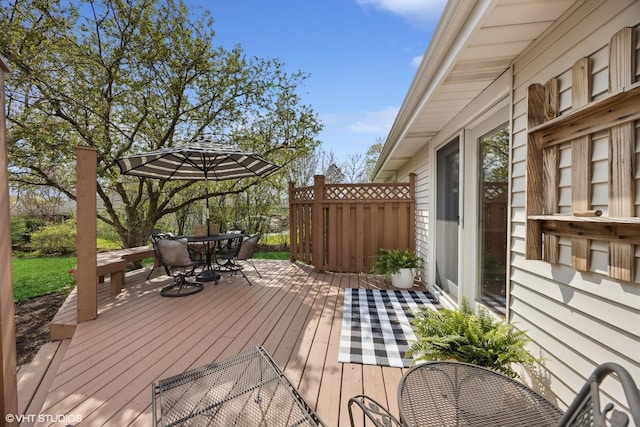 wooden deck with outdoor dining space