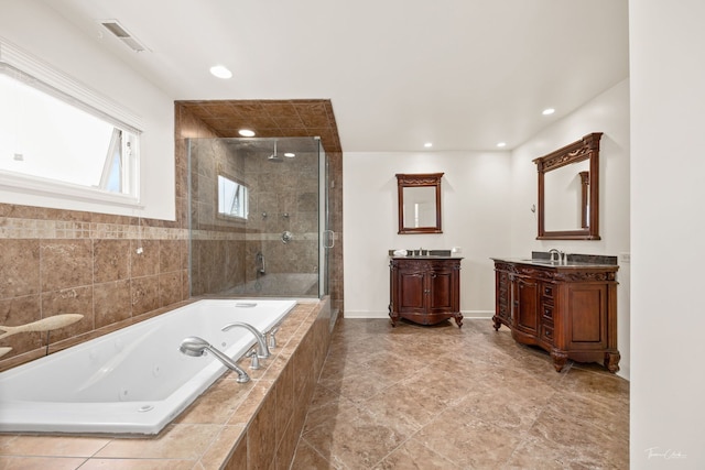 bathroom featuring a whirlpool tub, a shower stall, vanity, baseboards, and visible vents