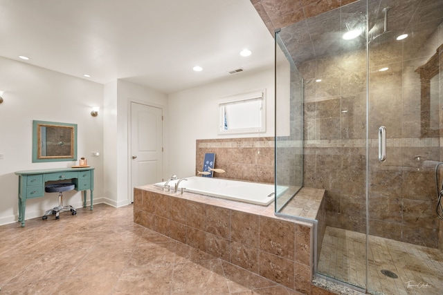 bathroom featuring recessed lighting, a shower stall, a bath, visible vents, and baseboards