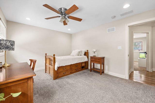carpeted bedroom with baseboards, visible vents, a ceiling fan, and recessed lighting