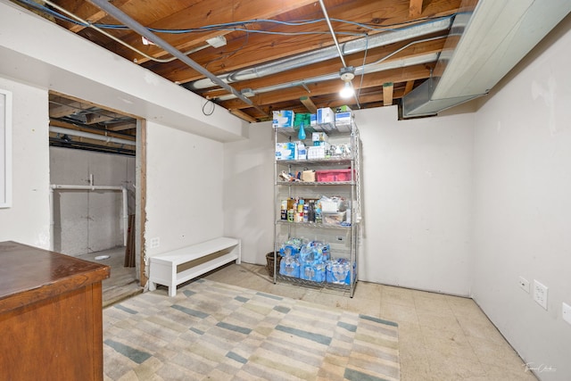 unfinished below grade area featuring tile patterned floors