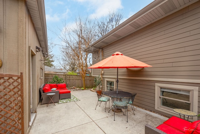 view of patio / terrace with an outdoor living space, outdoor dining area, and a fenced backyard