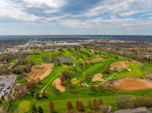 drone / aerial view featuring a water view and view of golf course