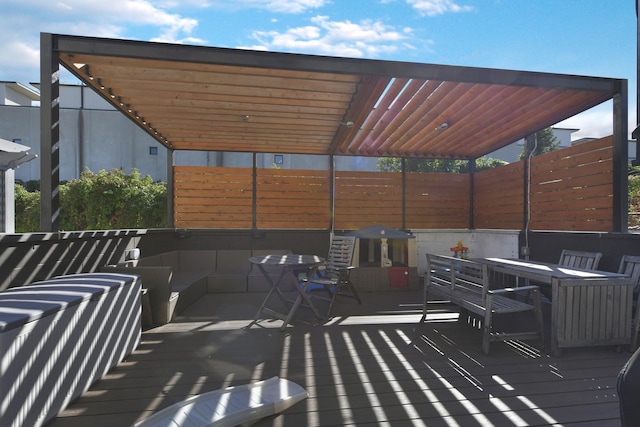 deck featuring fence and outdoor dining space