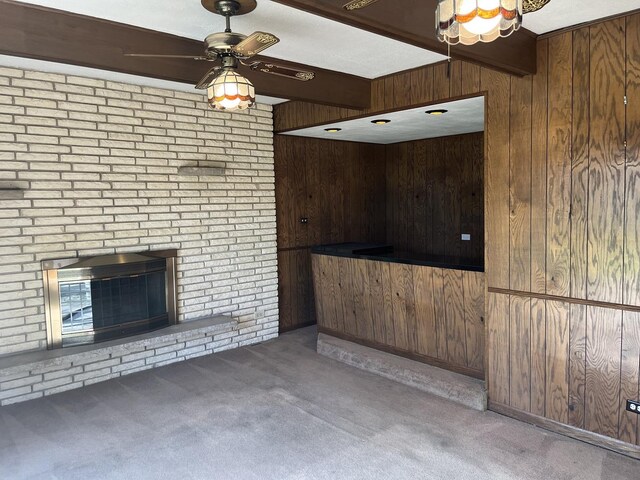 9609 S Kenneth Ave, Oak Lawn, IL 60453 - unfurnished living room featuring wooden walls, carpet flooring, ceiling fan, and a fireplace
