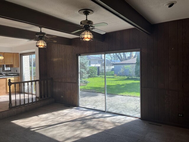9609 S Kenneth Ave, Oak Lawn, IL 60453 - interior space with carpet floors, a ceiling fan, beamed ceiling, and wood walls