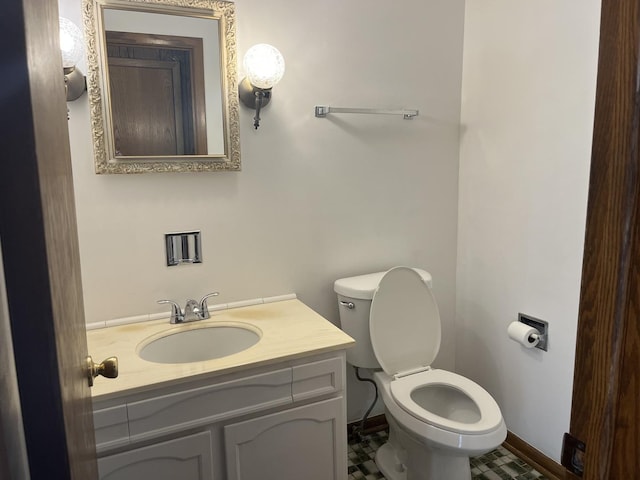 9609 S Kenneth Ave, Oak Lawn, IL 60453 - bathroom featuring toilet, baseboards, and vanity