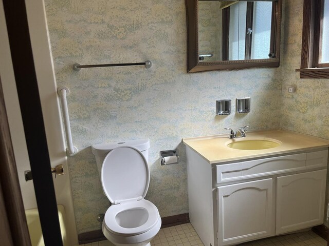 9609 S Kenneth Ave, Oak Lawn, IL 60453 - bathroom featuring vanity, tile patterned floors, toilet, and wallpapered walls