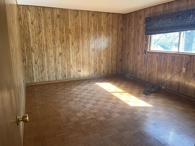 9609 S Kenneth Ave, Oak Lawn, IL 60453 - unfurnished room with baseboards, wood walls, and visible vents