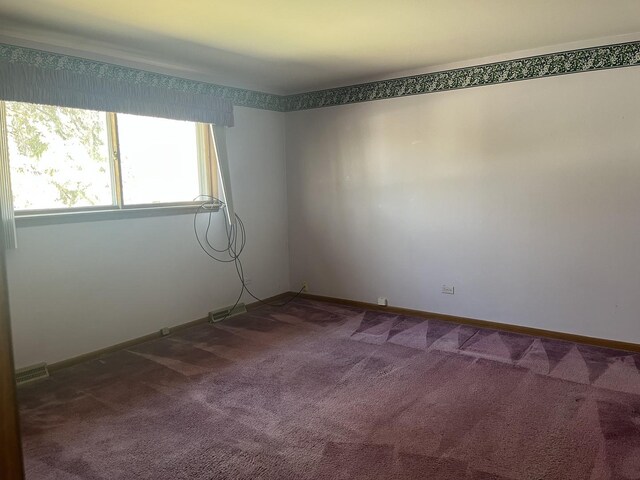 9609 S Kenneth Ave, Oak Lawn, IL 60453 - unfurnished room featuring baseboards, visible vents, and dark colored carpet