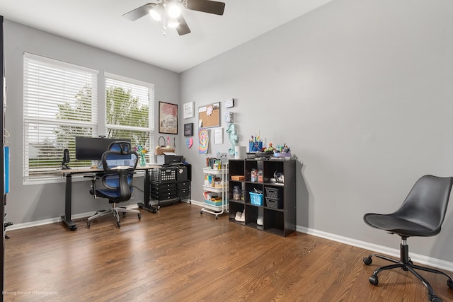 home office featuring baseboards, a ceiling fan, and wood finished floors
