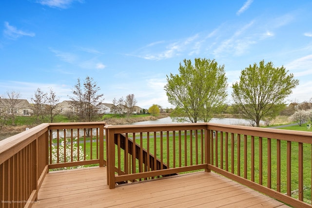 deck featuring a lawn and a water view