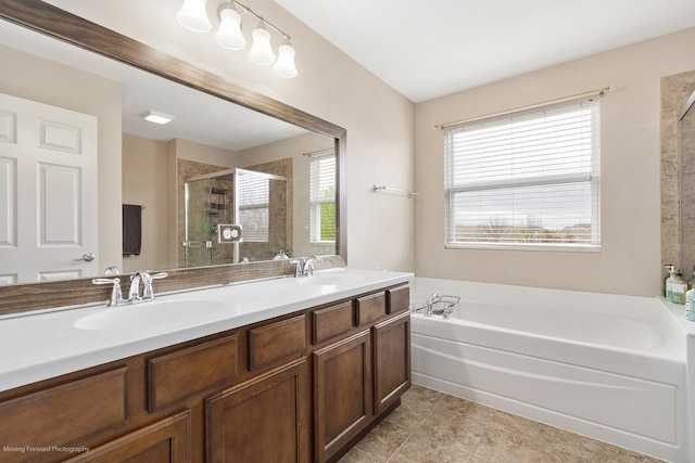 full bath featuring a bath, a shower stall, double vanity, and a sink