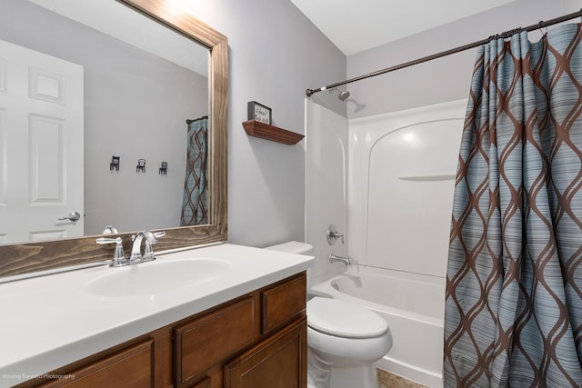 full bath featuring toilet, vanity, and shower / bath combo with shower curtain