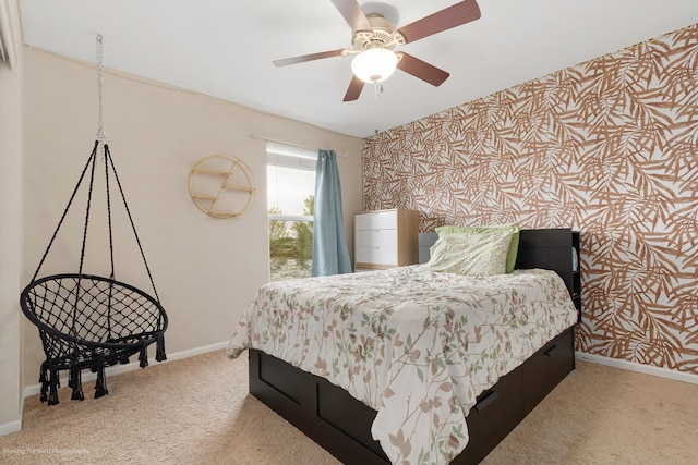bedroom with baseboards, carpet, and ceiling fan