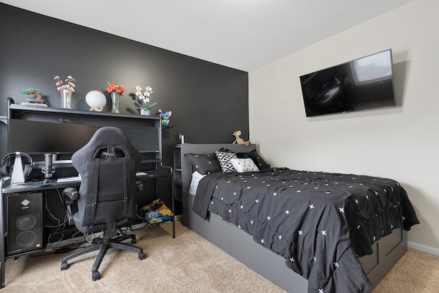 bedroom with baseboards and carpet floors