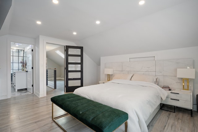 bedroom featuring recessed lighting, vaulted ceiling, light wood-type flooring, and baseboards