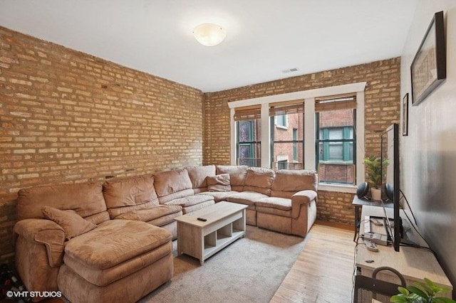 3128 W Carmen Ave Unit 2, Chicago, IL 60625 - living area featuring brick wall and wood finished floors