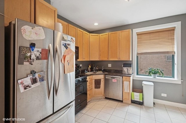 3128 W Carmen Ave Unit 2, Chicago, IL 60625 - kitchen with black appliances, a sink, dark countertops, light tile patterned floors, and light brown cabinets