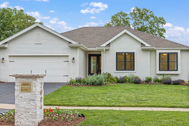 1004 Golden Ave, Woodstock, IL 60098 - ranch-style home featuring a garage, roof with shingles, a front lawn, and aphalt driveway