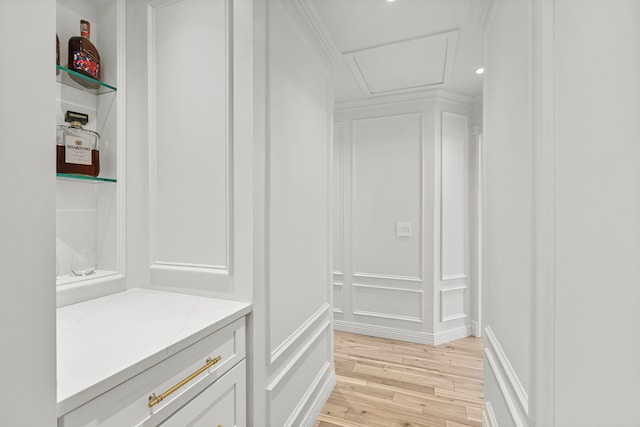 1004 Golden Ave, Woodstock, IL 60098 - mudroom featuring a decorative wall, ornamental molding, and light wood-type flooring