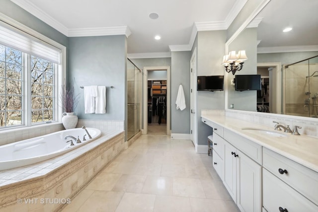 full bath with a spacious closet, a healthy amount of sunlight, and a stall shower