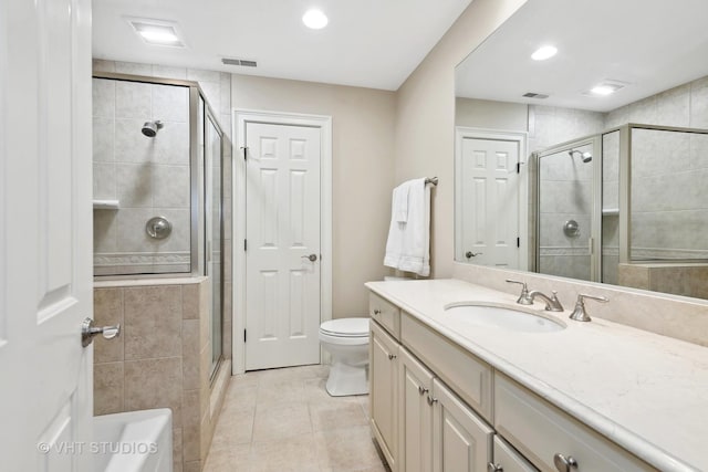 bathroom with vanity, tile patterned flooring, visible vents, and a stall shower