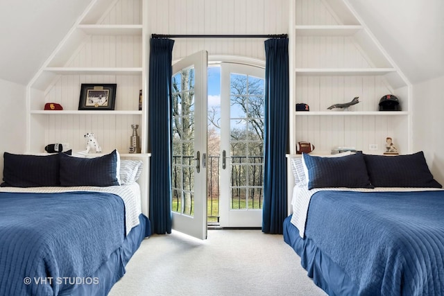 bedroom with carpet, lofted ceiling, and multiple windows