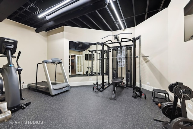 workout area featuring baseboards