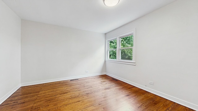 7350 N Karlov Ave, Lincolnwood, IL 60712 - spare room with wood finished floors and baseboards