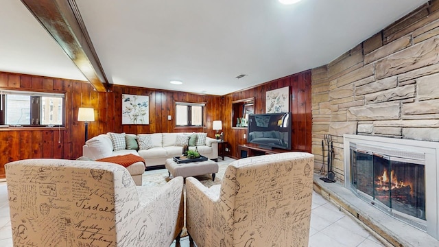 7350 N Karlov Ave, Lincolnwood, IL 60712 - living room with wood walls, light tile patterned floors, and a stone fireplace
