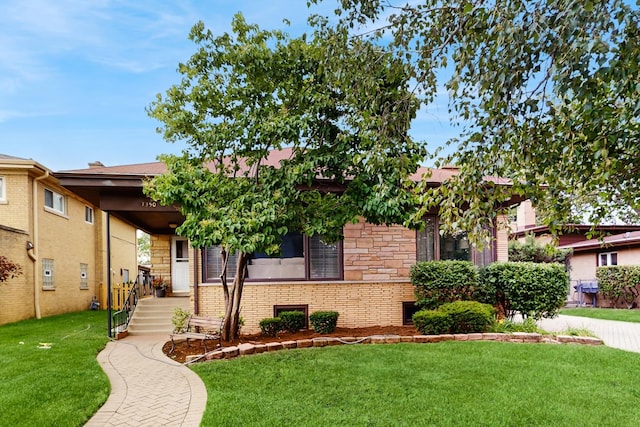 7350 N Karlov Ave, Lincolnwood, IL 60712 - view of front of property with stone siding and a front yard