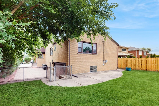 7350 N Karlov Ave, Lincolnwood, IL 60712 - back of property featuring a fenced backyard, brick siding, and a patio area