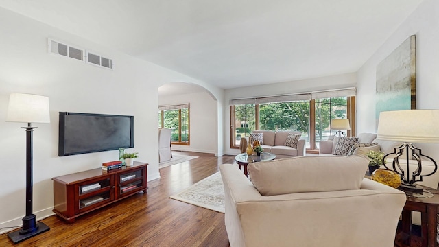 7350 N Karlov Ave, Lincolnwood, IL 60712 - living room featuring arched walkways and wood finished floors