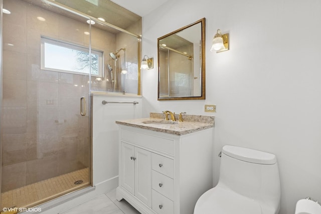bathroom with vanity, marble finish floor, toilet, and a shower stall