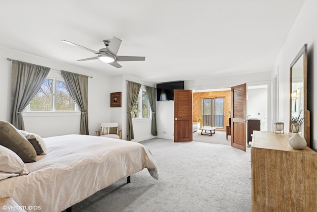 bedroom featuring ceiling fan and light carpet