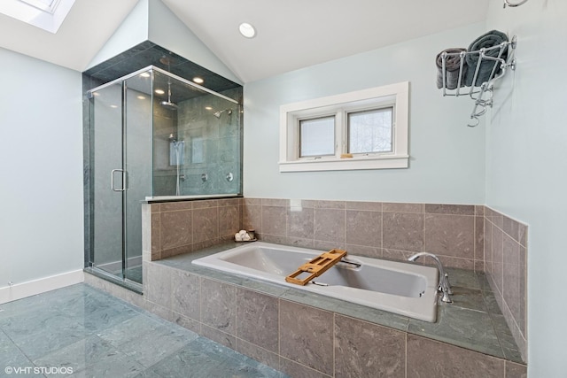 full bath featuring recessed lighting, a stall shower, lofted ceiling with skylight, and a bath