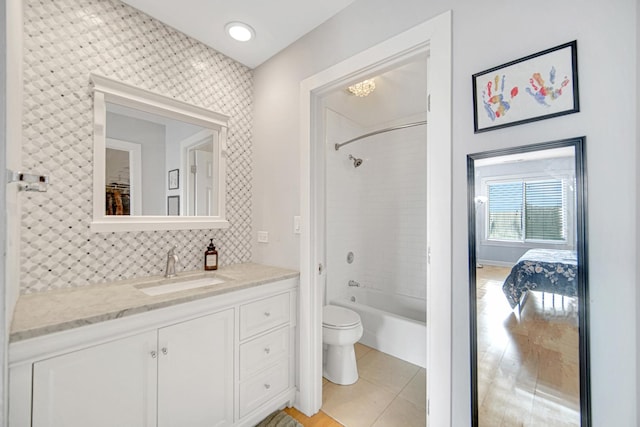 2201 S Grace St Unit 608, Lombard, IL 60148 - full bath with tile patterned flooring, vanity, toilet, decorative backsplash, and bathing tub / shower combination