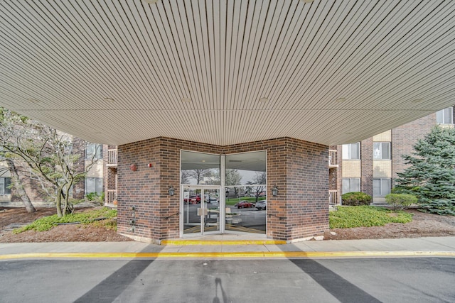 2201 S Grace St Unit 608, Lombard, IL 60148 - view of exterior entry featuring brick siding