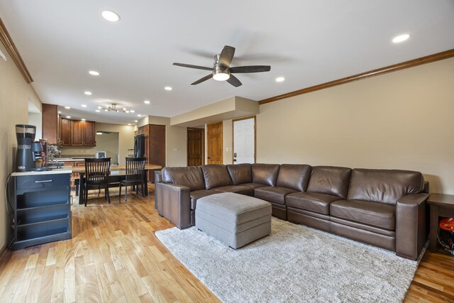 living room with ceiling fan, recessed lighting, and ornamental molding