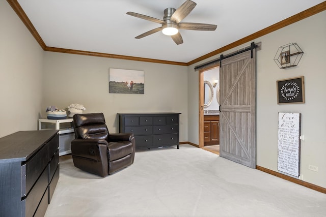 sitting room with a barn door, light carpet, ceiling fan, baseboards, and crown molding