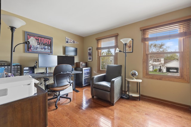 office space featuring light wood finished floors and baseboards