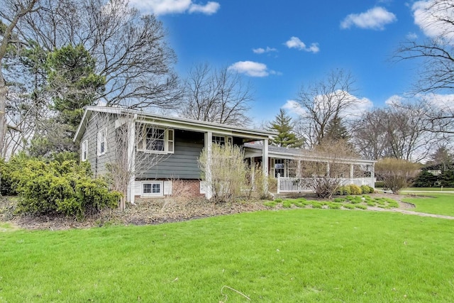 split level home featuring a front yard and covered porch