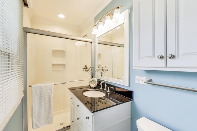 bathroom featuring recessed lighting, vanity, toilet, and a stall shower