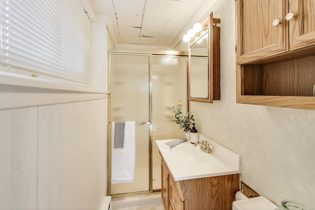 full bathroom featuring vanity, toilet, and a stall shower