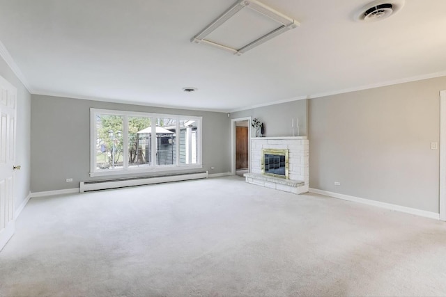unfurnished living room featuring attic access, baseboards, carpet, a baseboard radiator, and ornamental molding
