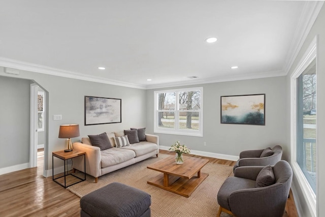 living room featuring recessed lighting, wood finished floors, and baseboards