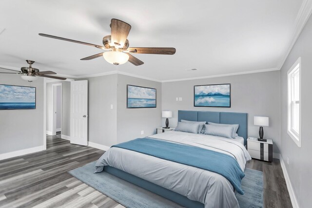bedroom with visible vents, wood finished floors, baseboards, and ceiling fan